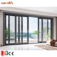 Ensemble de portes coulissantes doubles en aluminium noir avec moustiquaire pour balcon et patio extérieur de villa moderne