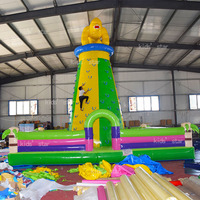 Structure gonflable portable géante avec toboggan et mur d'escalade, écologique, idéale pour les fêtes en extérieur et les rassemblements familiaux