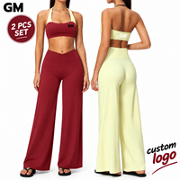 Nouvel ensemble de sport GM avec soutien-gorge intégré, haut à bretelles croisées, pantalon large taille haute, vêtements de fitness pour la gym, fourniture OEM, ensembles de yoga et d'entraînement pour femmes