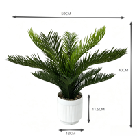 Vente en gros usine : Plante artificielle Cycas Revoluta en pot, faux palmier Sago Bonsaï avec pot blanc pour la décoration de bureau et de table