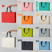 Sac fourre-tout en papier de luxe personnalisé OEM/ODM avec poignée intégrée, sacs en papier durables pour emballages de bijoux et de vêtements