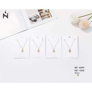 Collana con ciondolo a croce Z in acciaio inossidabile placcato oro, set minimalista da 12 pezzi per donna, da indossare tutti i giorni - Product Image 1