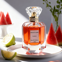 Flacon de parfum hexagonal en verre transparent de luxe 70 ml avec pompe pulvérisatrice, bouchon en acrylique sérigraphié, emballage en boîte cadeau cylindrique