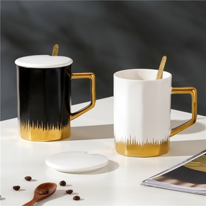 Manufacturer Selling Minimalist Style <b>Ceramic</b> <b>Cup</b> <b>Ceramic</b> Mug with Gold Handle with a Porcelain Lid and a Golden Spoon - Product Image 1