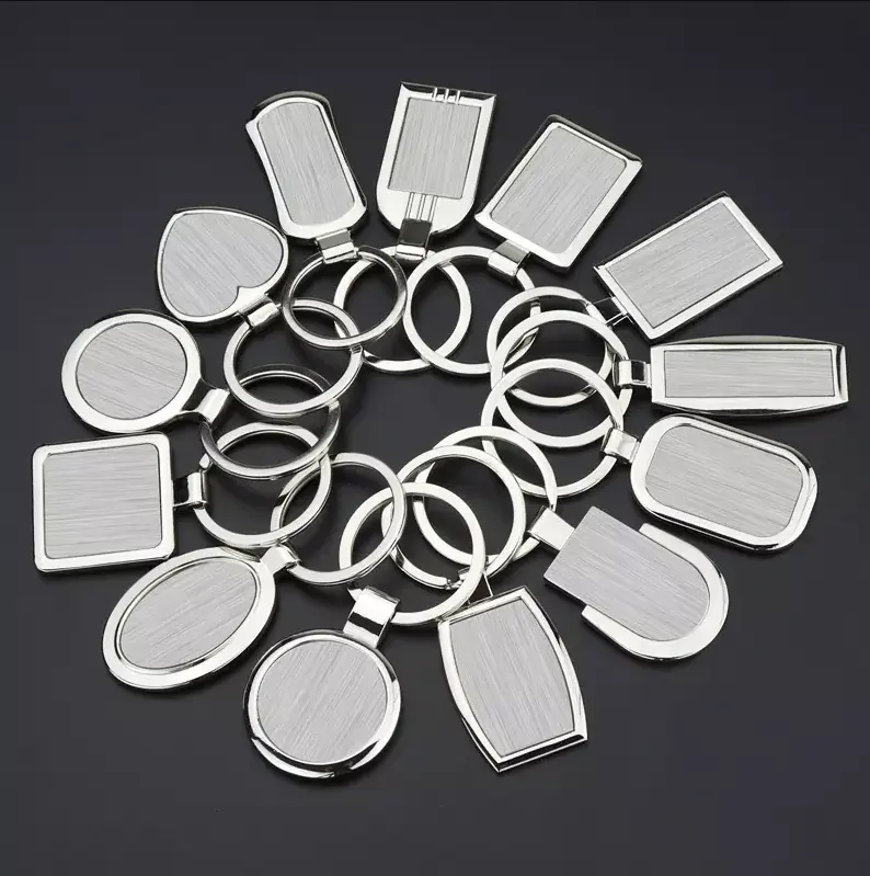 Portachiavi rotanti rotondi in metallo con Logo personalizzato in bianco portachiavi in acciaio inossidabile in lega di zinco