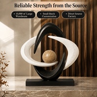 Sculpture moderne en résine noire et blanche à anneau ouvert avec sphère en verre de 6 cm pour la décoration de salon et de bureau, vente en gros