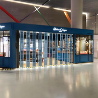 Porte de magasin pliante manuelle moderne en cristal PC, cadre en aluminium fini, solution complète pour usage commercial en centre commercial
