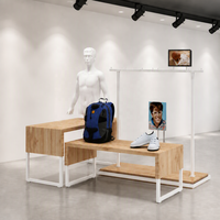 Armoire de présentation de vêtements haute en métal noir avec étagères, tringle de suspension et rebord photo, export