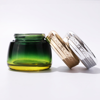 Pot en verre vide de luxe 100g vert mat avec motif plaqué et couvercles métalliques pour sérum cosmétique et crème visage