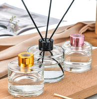 Bouteille en verre diffuseur de roseaux moderne ronde avec bouchon en caoutchouc imprimé à l'écran, 100 ml, 150 ml, vente en gros, OEM/ODM, emballée en carton