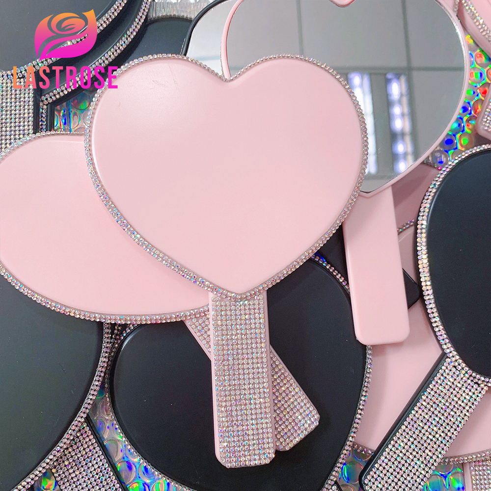 Pink heart shaped handheld mirror with rhinestone