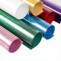 Muestra gratis ecológica al por mayor TPU brillo plotter corte láser de alta calidad película de transferencia elástica vinilo en el logotipo