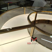 Comptoir de présentation de bijoux rond OEM haut de gamme, vitrine incurvée en verre, îlot central circulaire avec rangement pour boutique de montres et usine