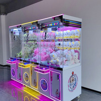 Machine à pince à poupées commerciale très populaire, entièrement transparente, grande, en plastique, avec construction robuste, à monnayeur, pour aire de jeux, dotée d'un clip de suspension, garantie 1 an