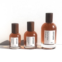 Fabricante de botellas de perfume vacías 30ml 50ml 100mL Cilindro de fragancia Botellas de vidrio redondas con tapa de madera