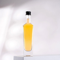 Bouteilles en verre transparentes de 50 ml de qualité supérieure pour l'emballage de la vodka et du whisky, vente en gros dans une boîte personnalisée