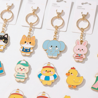 Vente en gros fabricant : Porte-clés vintage en émail motif dessin animé, breloques en métal avec pompon - Design personnalisable, étanche, couleur sur mesure