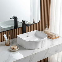 Salle à manger Design Lavabo Lavabo en céramique Prix Lavabo de comptoir Lavabo de salle de bain de forme unique