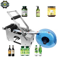 Machine d'étiquetage semi-automatique Mt-50c pour bouteilles rondes, pots, bidons, flacons, pots en verre, pour sauces, crèmes, cosmétiques et eau