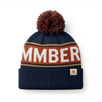 Bonnet en tricot jacquard acrylique bleu marine et orange brûlé avec pompon et patch brodé 3D pour homme – Collection Hiver