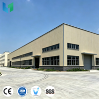 Grand hangar en acier modulaire à structure métallique pour la manutention de conteneurs et de marchandises
