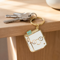 Porte-clés en émail, pendentif livre mignon de dessin animé, breloque visage, accessoires de sac à dos en métal doré, cadeau, marque-page 'READ', vente en gros