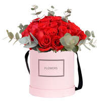 Vente en gros de boîte cadeau d'emballage de fleur rigide noire en papier de carton rond de luxe personnalisé avec ruban