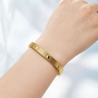 Bracelet unisexe en acier inoxydable avec moteur à vis et sangle élastique, idéal comme cadeau