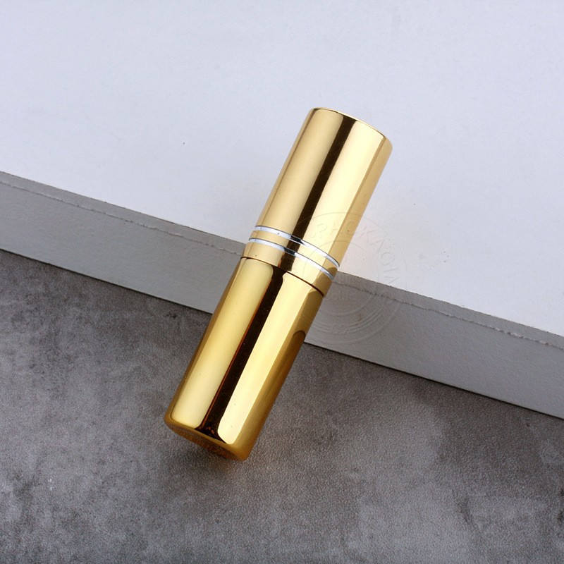 Gold bottle with double line cap