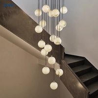 Lustre minimaliste postmoderne en albâtre, lampe suspendue sphérique artistique multi-lumières pour escalier, villa, salon