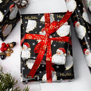 Papel de regalo navideño con diseño de cabeza de Papá Noel negro, con líneas de corte en la parte posterior, impresión a doble cara, personalizable - Product Image 1