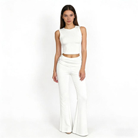 Nouvel ensemble pantalon deux pièces extensible pour le printemps, avec débardeur court sans manches et pantalon évasé moulant, tenue décontractée