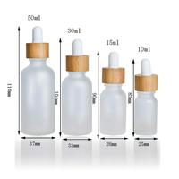 Flacon compte-gouttes givré pour huiles essentielles 10 ml avec bouchon en bambou