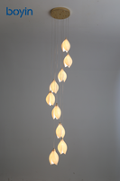 Lustre long de luxe en forme de fleur de magnolia, suspension nordique en porcelaine multi-têtes rotative pour escalier à plafond haut