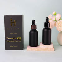 Vente en gros de flacons compte-gouttes en verre noir mat de luxe vides de 15 ml à 100 ml pour huile essentielle pour barbe et cheveux, avec impression sérigraphique et boîte magnétique
