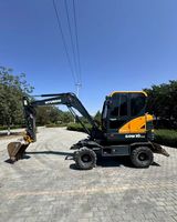 Excavatrice sur pneus Fuel-Smart Hyundai 60W VS PRO avec moteur Cummins, force de rupture élevée de 6 tonnes, hydraulique précise et fluide