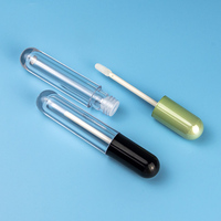 Récipient à rouge à lèvres en plastique transparent de luxe OEM Tube de balle de brillant à lèvres vide avec logo personnalisé avec sérigraphie Étiquetage cosmétique