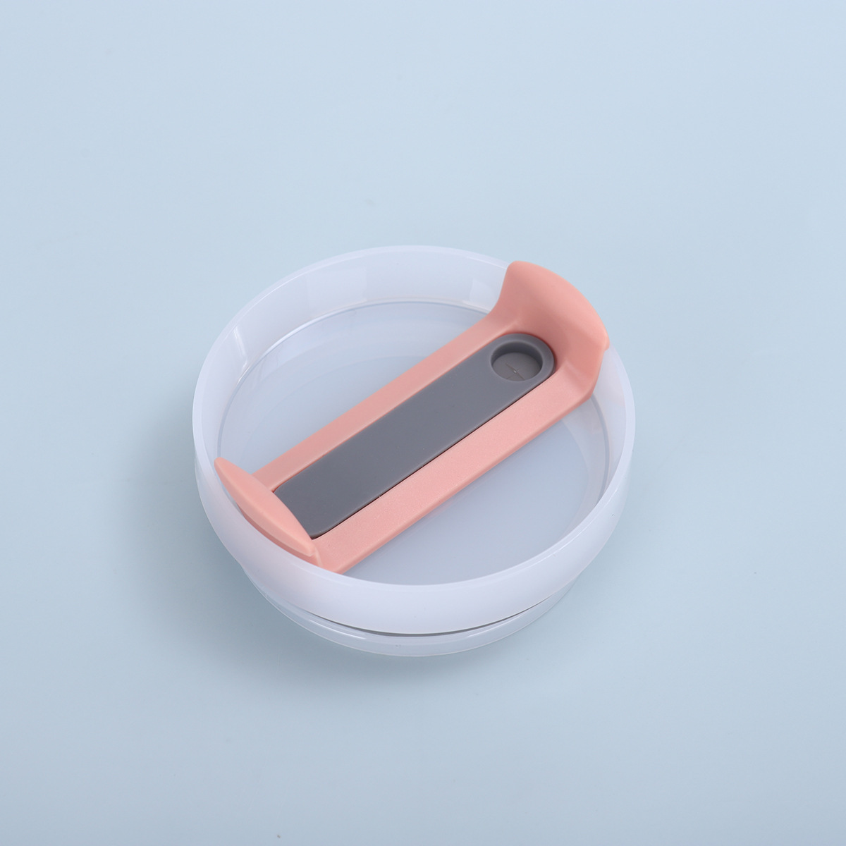 Corps blanc laiteux, comprimés orange, silicone gris.