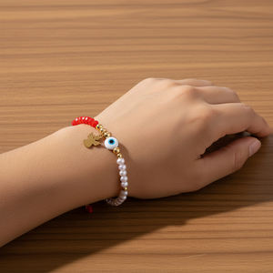 Bracelet de protection contre le mauvais œil Go2boho, bracelet en cordon rouge avec perle en verre bleu et charme ange pour femmes - Product Image 1