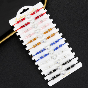 Nueva llegada al por mayor 12 piezas Evil Eye Fatima Hand Black Bead <span class=keywords><strong>String</strong></span> Bracelet hecho a mano tejido personalizado Set pulsera - Product Image 4