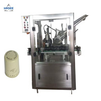 Machine de pose et de rétrécissement de capsules de vin en aluminium, machine de pose et de sertissage de capsules de bouteilles de vin en PVC et en aluminium multicouche
