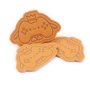 ป้ายหนังแท้สำหรับติดเอวเสื้อผ้า ป้ายหนังวัวแท้ ปั๊มโลโก้ ขายส่ง - Product Image 1