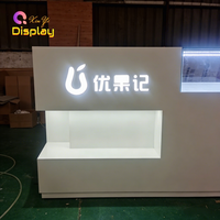 Kiosque de réception commercial moderne en MDF robuste avec LED, recyclable, taille et couleur personnalisables, vente en gros d'usine pour magasins de détail