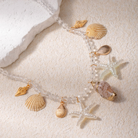 Collier de plage bohème transfrontalier : Bijou pendentif en faux perles, coquillages, étoiles de mer et conques
