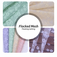 Tissu en tulle floqué floral en gros, maille en nylon tricotée à cinq pétales pour robe de mariée, costume de mode, couture DIY