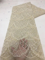 Tissu en dentelle africaine à sequins en gros avec broderie en maille et perles élastiques 100 % polyester pour robes de mariée