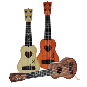<span class=keywords><strong>Guitare</strong></span> Ukulélé <span class=keywords><strong>Jouet</strong></span> <span class=keywords><strong>en</strong></span> Plastique Imitation <span class=keywords><strong>Bois</strong></span> Vente <span class=keywords><strong>en</strong></span> Gros Style Tendance et Économique pour Enfants Débutants Fabriqué <span class=keywords><strong>en</strong></span> Chine - Product Image 1