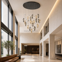 Lustre en verre ondulé ambre et fumé, suspension sculpturale en cascade pour entrées d'hôtels et grands escaliers