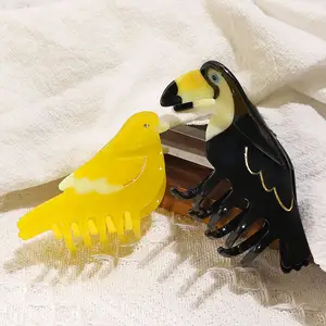 XinMei tasarımcı sarı kuş şekilli saç pençe klipsleri high end kalite asetat siyah papağan hayvan pençe saç klipler için kalın saç