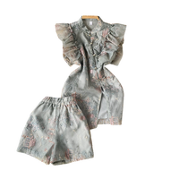 Ensemble deux pièces Cheongsam amélioré de style chinois pour femme, avec haut brodé à manches volantées et short, idéal pour le printemps et l'été
